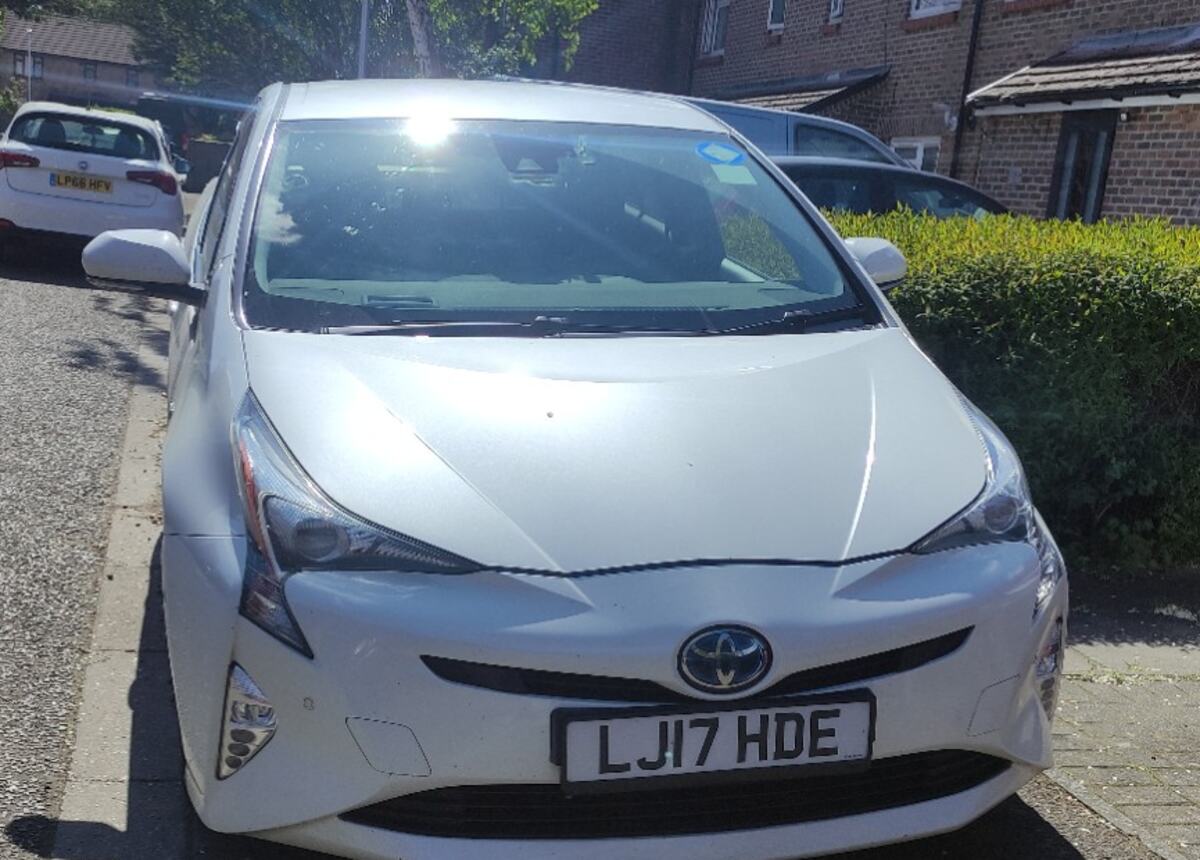 Donegan Express Ltd Toyota Prius in daylight