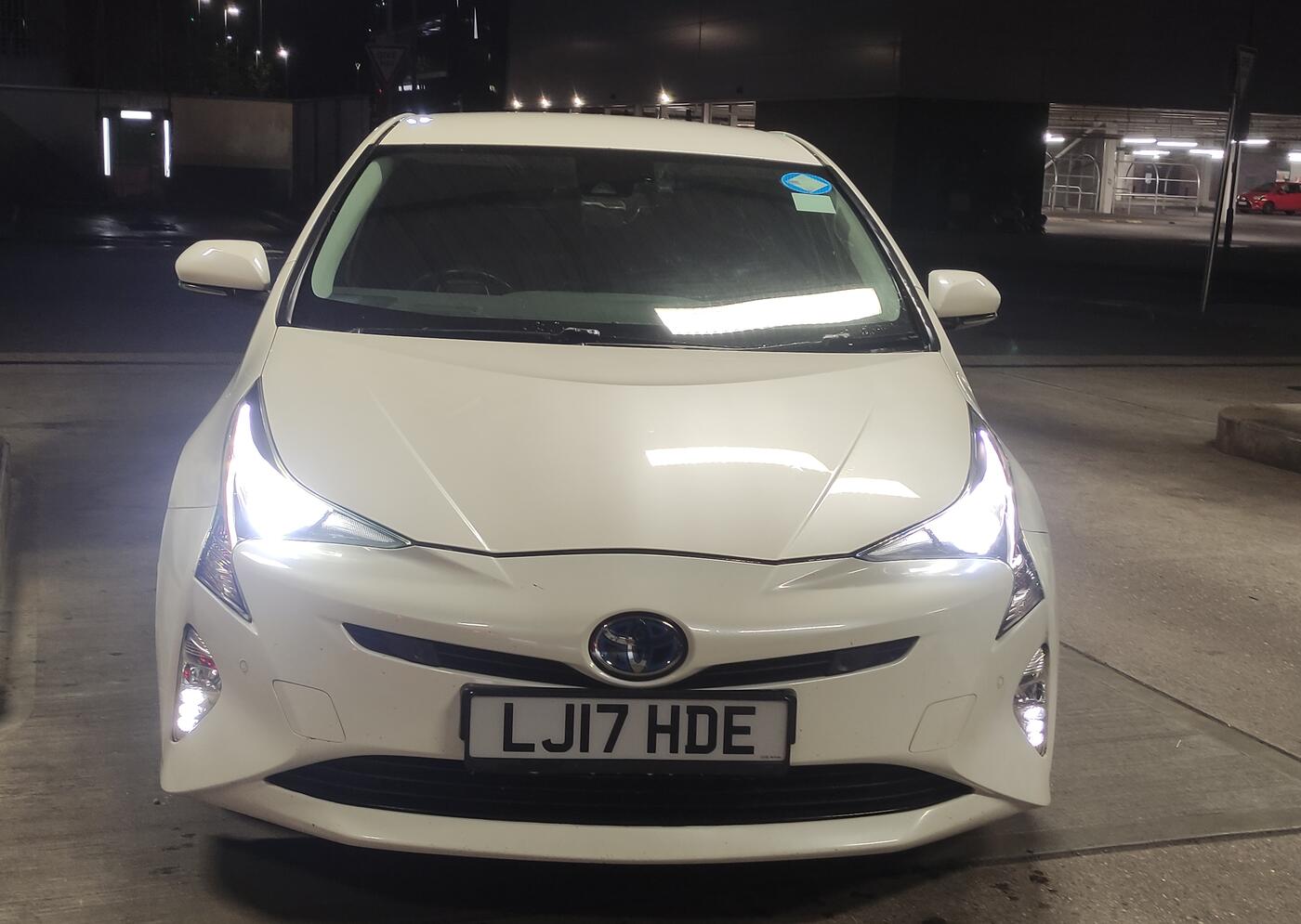 Front of the Donegan Express Ltd Toyota Prius with headlights on